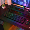 Redragon K526 PRO black keyboard viewed diagonally on an RGB gaming desk