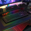 Redragon K526 PRO black keyboard in a desktop gaming setup, viewed from the front